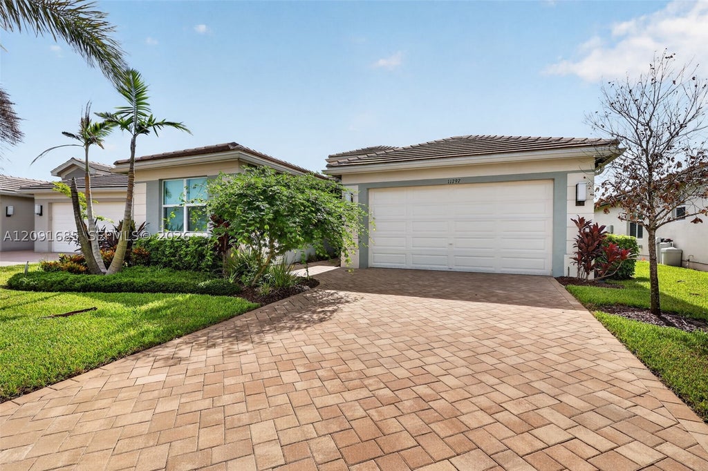 Photo of 11797 SW Coral Cove Pkwy, Port St Lucie, FL 34987 (MLS # A12091685)