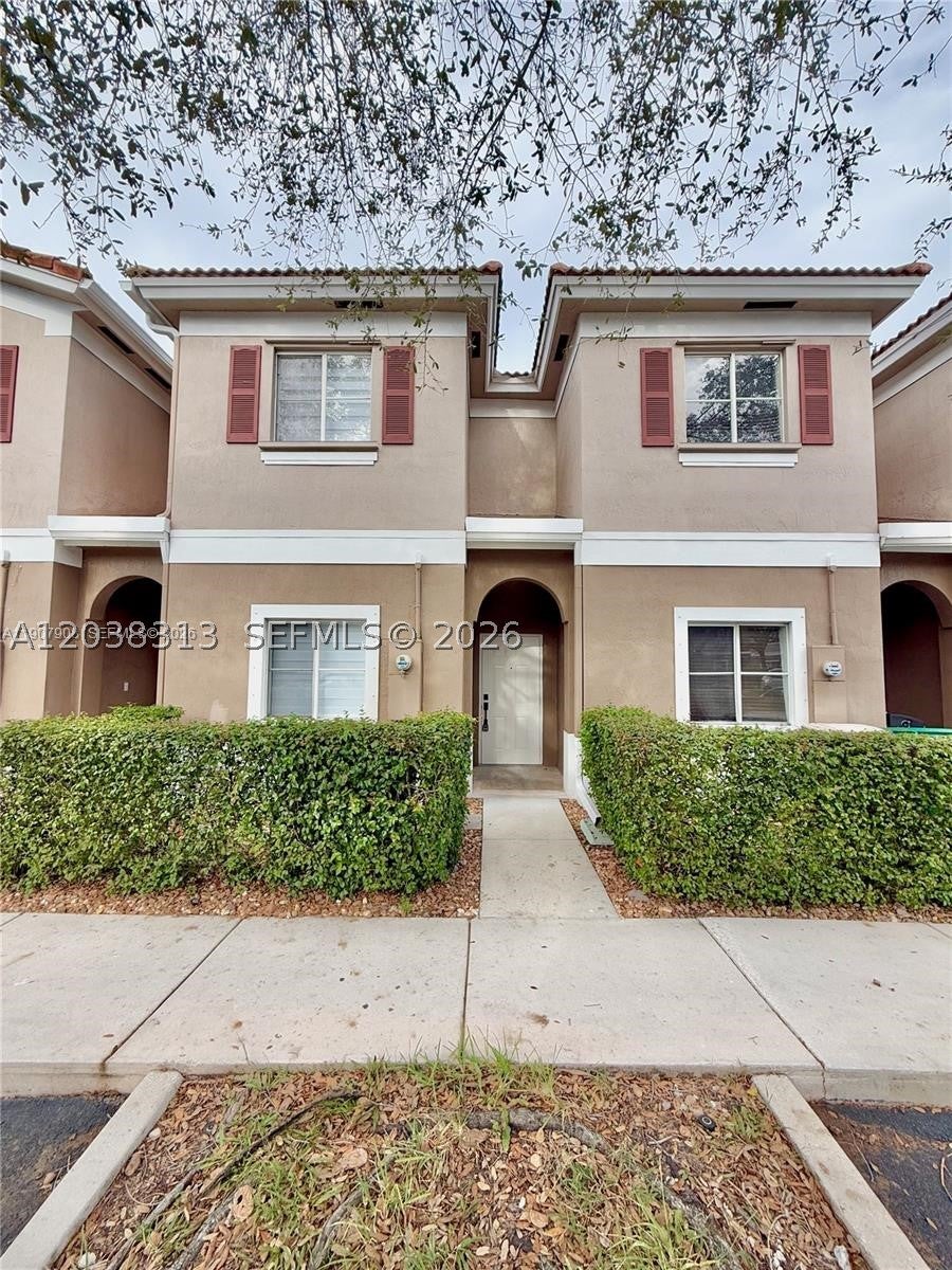 Photo of 4412 Woodland Cir #4412, Tamarac, FL 33319 (MLS # A12038313)