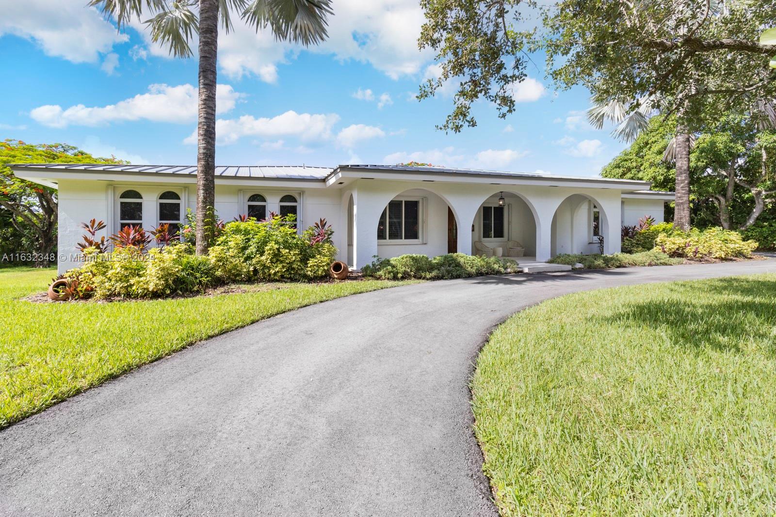 Incredible Pinecrest value!  Large and nicely updated north central Pinecrest home on a full half acre lot (22,594 sqft) with over 3300 living sqft (3895 adjusted sqft).  Meticulously cared for house with 2018 metal roof and various other 2024 updates including new paved driveway, fresh paint job inside and out, new pool decking, and more!   A mix of impact glass and hurricane shutters, HUGE living spaces and bedrooms, and a wonderful family layout.  Large screened-in pool-patio area leading to a nice back and side yard with plenty of space to run around and entertain.  The best schools and an ideal location with access to all!