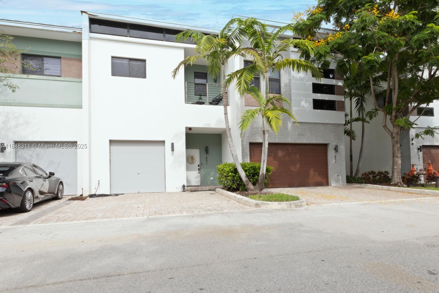 Modern Townhouse in Move-In Ready Condition Located in the Gated Community of Strata Plantation. This Bright and Spacious 3/2.5 Townhome offers a Wonderful Blend of Contemporary Style with 12' Ceilings, Open Concept Kitchen, Sleek Panel Shades, Modern European Style Cabinets, Waterfall Quartz Countertops, Stainless Steel Appliances, Full Size Washer/Dryer and Impact Windows. Ceramic Tile Floors throughout First Floor and Laminate Throughout Second Floor. Primary Suite is an Open and Airy space with En-Suite, Large Walk-in Closet and Open Veranda for Your Morning Coffee or Afternoon Cozy Reads. Resort-style Amenities include a Clubhouse with a Pool Table, Swimming Pool, Gym, Lounge, Dog Park, Children's Playground, and Trails. Flood Zone X! Roof repairs covered by HOA!