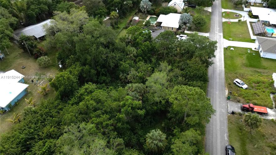 Vacant lot on a quiet street on the north end of Lakewood Park. Build your home and enjoy proximity to shops, schools, and services. Residents enjoy large pool, sports grounds and hiking trails. No restrictions!. Size are approx/subj to error