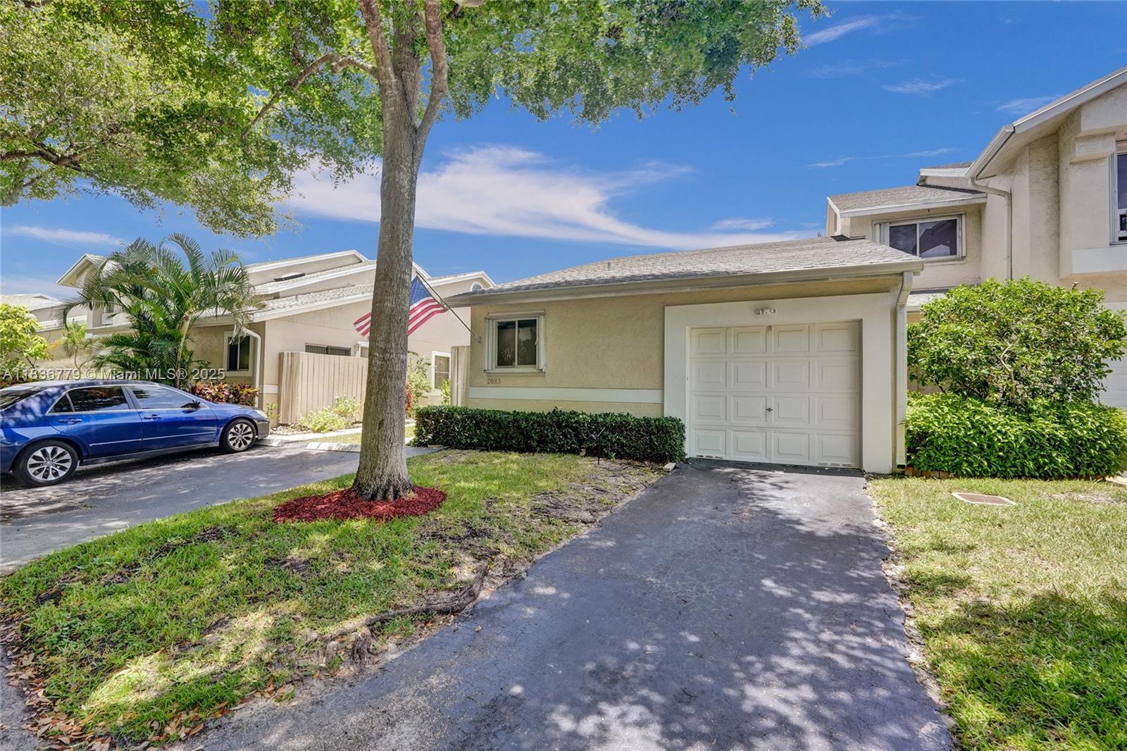 Beautifully updated 2-bedroom and 2-bathroom model on a large corner lot with mature trees, steps to the pool, tennis/pickleball courts & clubhouse. In the sought-after CORAL POINT NORTH. This lovely home features a split floor plan with w/laminate flooring throughout the spacious living room, formal dining area, kitchen & carpet in the bedrooms. The kitchen has beautiful off-white cabinetry, generous countertop space, a stylish tile backsplash & stainless-steel appliances. The spacious primary bedroom features an updated bathroom, and a walk-in closet w/custom cabinetry. The second bedroom is carpeted & conveniently located near the second bathroom. Enjoy the large, tiled, screened-in patio for year-round outdoor living with a beautiful lake view.
