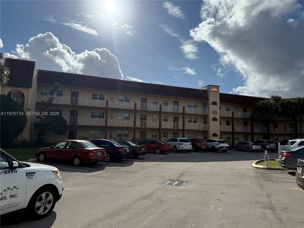 Photo of 2721 N Pine Island Rd #202, Sunrise, FL 33322 (MLS # A11970734)