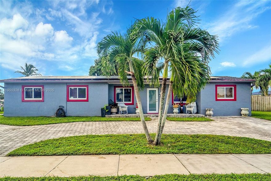 Welcome to Palm Springs North a Corner Lot Home No HOA!

Beautiful 3BR/2BA home with a private in-law quarters/ apartment featuring a full kitchen, bedroom, bath, and living room potential rental $1800 monthly. Newer roof, A/C, and impact windows. Freshly painted with a remodeled kitchen, stainless steel appliances, and energy-saving solar panels a huge savings on your electrical bill!

Enjoy a huge, fenced backyard with a tile terrace covered, overlooking the mango tree with the juiciest sweet mangos! Room for a pool, and ample parking for your boat, trailer, or RV. Includes one-car garage and semi-circular paver driveway.

Assumable mortgage rate 2.75% amount $160,00 .00. Top rated schools, Spanish Lakes Elementary, Chiles Middle, Barbara Coleman High. Near Don Shula's Golf!
