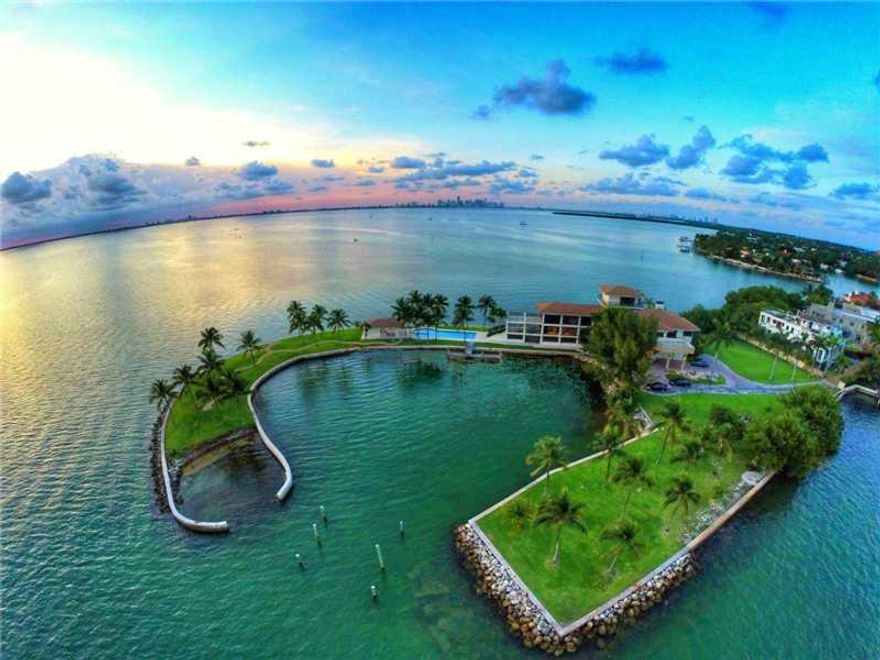 Greatest property  in South Florida - EVER. Captivating waterfront 2 acre gated grand estate on a private penninsula overlooking Biscayne Bay w/the Miami skyline as a backdrop.  2000 ft water frontage. 5 story 12000 sqft 6 bedrooms 8 full baths w/stunning  360 degree water & city views. Fabulous pool & gazebo area. Private deep water yacht harbor. Property was the playground of America's elite at the turn of the century. (Vanderbilt's, Carnegie's & the likes partied here).