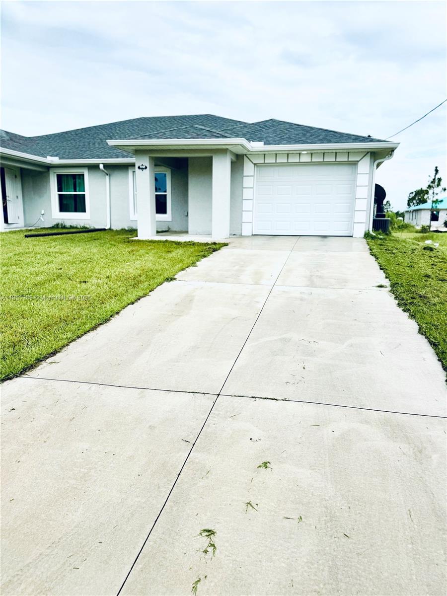 This rare opportunity offers a beautifully maintained multi-family home featuring two units, one of only two in the quiet, sought-after neighborhood of Lehigh Acres. Built in 2023, this unit is move-in ready and available for immediate occupancy.
The spacious 3-bedroom, 2-bathroom home includes a one-car garage and boasts elegant porcelain tile flooring throughout. Enjoy cooking in the modern kitchen equipped with stainless steel appliances. Relax or entertain on the inviting porch, terraza, and patio areas.
Located on a peaceful street, this property combines comfort, convenience, and style. Don’t miss out — schedule your private tour today! Easy application process. Call now to secure your new home!