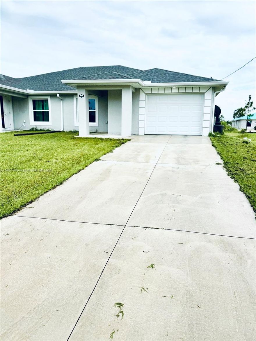 This rare opportunity offers a beautifully maintained multi-family home featuring two units, one of only two in the quiet, sought-after neighborhood of Lehigh Acres. Built in 2023, this unit is move-in ready and available for immediate occupancy.
The spacious 3-bedroom, 2-bathroom home includes a one-car garage and boasts elegant porcelain tile flooring throughout. Enjoy cooking in the modern kitchen equipped with stainless steel appliances. Relax or entertain on the inviting porch, terraza, and patio areas. 

Located on a peaceful street, this property combines comfort, convenience, and style. Don’t miss out — schedule your private tour today! Easy application process. Call now to secure your new home!