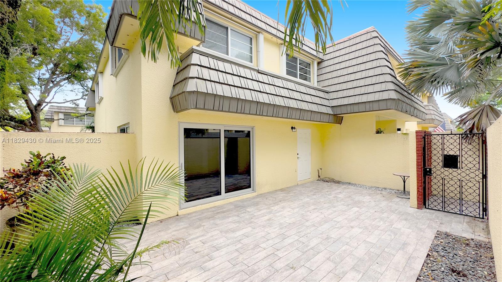 Bright and spacious 2-story CORNER townhouse in Kendall Lakes! This home has it all; IMPACT windows that bring in lots of light, huge private front courtyard patio and back patio with lawn, spacious rooms, plenty of storage! Bedrooms are upstairs. Master bedroom suite features an extra sunny area perfect for an office, an extra-large custom closet, and newly redone bath with roomy shower. BOTH upstairs bathrooms are UPDATED. Add two additional generously sized bedrooms that share a bath, the result is a wonderful layout and home. The laundry room has a full-sized washer and dryer room located off of the covered patio. Located in a great Kendall area of many conveniences. Simply perfect!