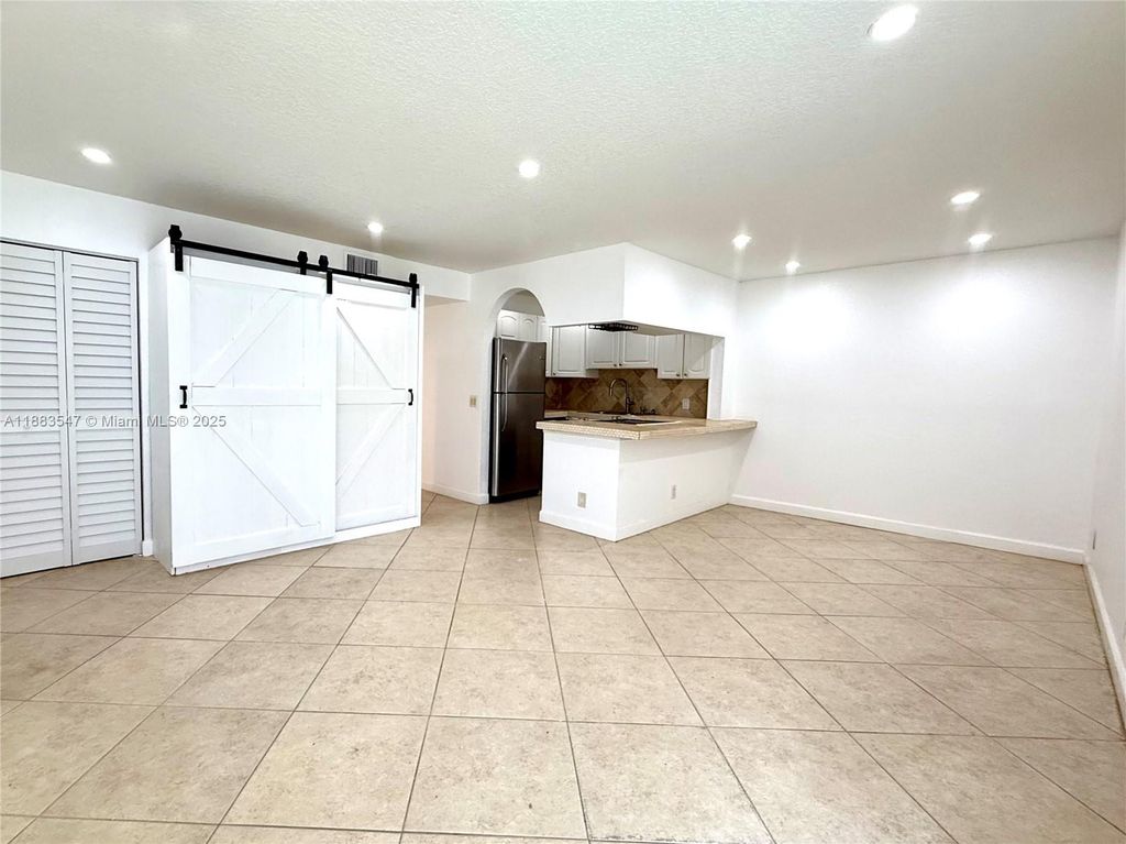 Photo of 3032 Coral Ridge Dr #217C, Coral Springs, FL 33065 (MLS # A11883547)