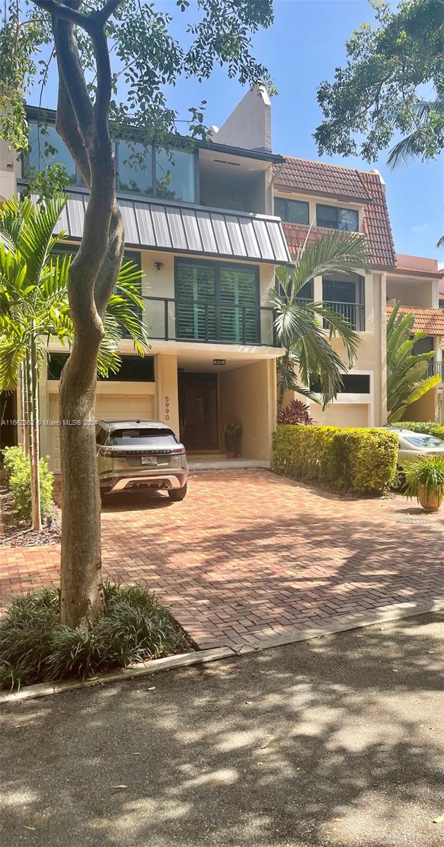 Experience unparalleled luxury in this waterfront townhouse situated in the gated community of Royal Harbour Yacht Club. This impeccably updated residence boasts 4 beds, 3 baths & 3 levels of expansive, open-concept living spaces. Revel in awe-inspiring water vistas from each floor & savor the multiple living areas, including a spacious waterfront patio. The 1st floor showcases a welcoming family room w/a wet bar & built-ins, while the 2nd floor accommodates the living/dining area, remodeled kitchen, 2 guest rooms & laundry room. Ascend to the top level to discover a private master suite, w/space for a gym & balcony. Recent enhancements incl impact glass, metal roof & upgraded kitchen & baths, ensuring both appeal & longevity. A 1.5-car garage finalizes this exceptional waterfront retreat.
