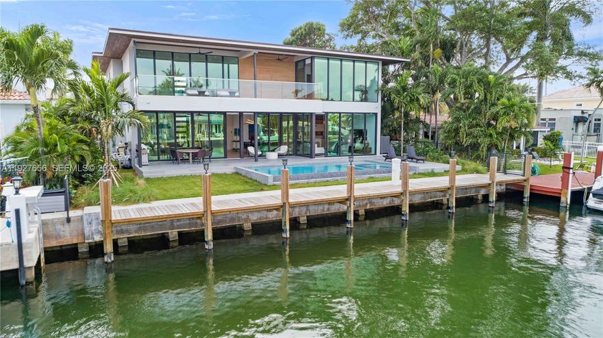 Sophisticated luxurious 2-story modern design on 70 ft. of deep water. State-of-the-art home with Lutron home automation, smart system wired for window treatments, lighting, speakers, and voice control. Honeywell security system, SIW high-impact energy-efficient windows with protective film. Elevator, chef’s kitchen including gas stove, SubZero & wine storage, steam & electric ovens. Heated infinity pool with spa, 2-car garage, 6 bedrooms, 6.5 baths.