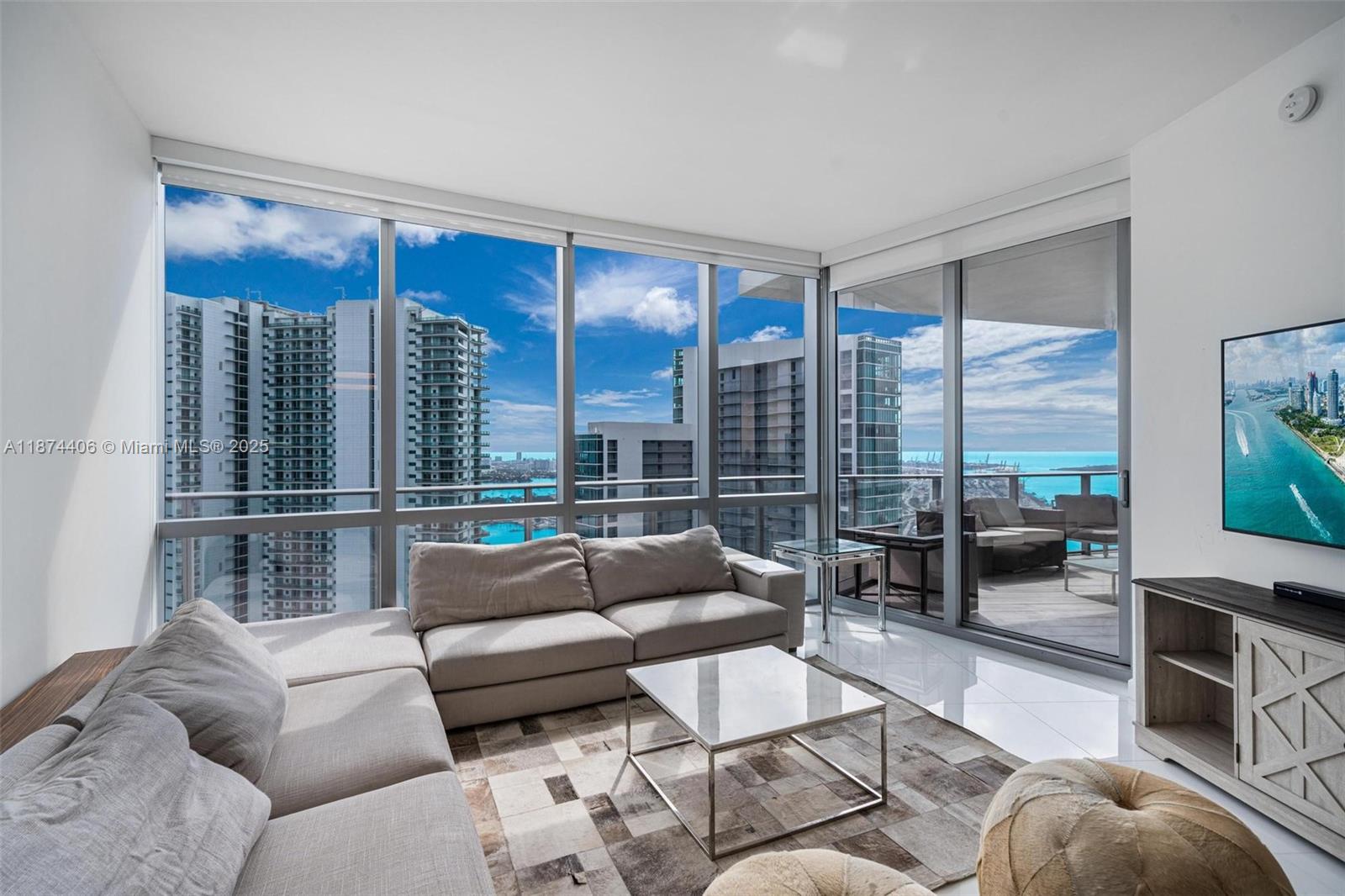 Welcome to the absolute most stunning 2bed/3bath + den with enclosed direct water view on one of the highest floors with rare huge wrap around terrace at Paramount Miami. Features include: private elevator, direct water view, huge terrace, floor to ceiling windows, 10 ft high ceilings, white tile floors, marble backsplash, gourmet kitchen w/Bosch and Sub Zero appliances, split floor plan, huge master bathroom w/sunken tub & shower, large walk in closet, enclosed den, washer/dryer area, spacious second bedroom with private bathroom + terrace. Have access to world class amenities: basketball, tennis, 5 pools, boxing, spa, gym, shopping and more.