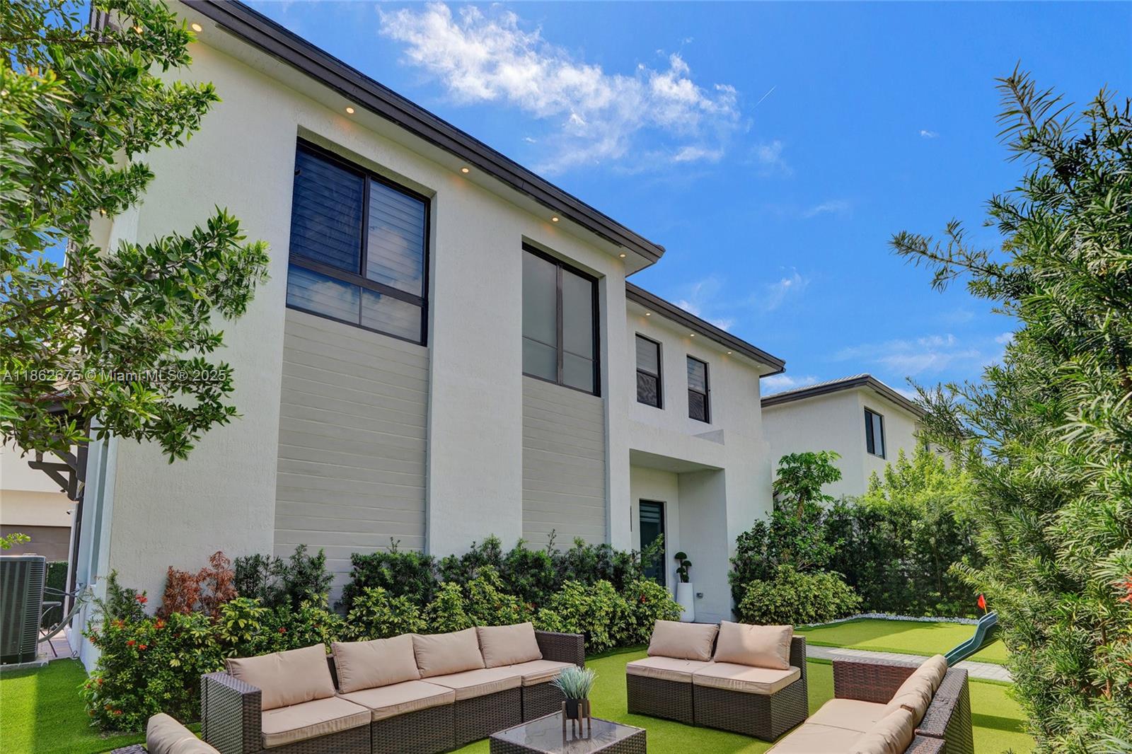 Own this spectacular house and make it your ideal home. This house is located in the CANARIAS Condominium in the heart of Downtown Doral, the most vibrant new town center. This house is sitting in a overside lot with a open floor plan and boasts three spacious bedrooms and two and a half bathrooms completely upgraded. The kitchen features elegant quartz countertops, gourmet island, high-end stainless steel appliances, Wolf kitchen and Italian cabinets perfect for cooking and entertaining. The house also includes a two-car garage Enjoy the resort-style clubhouse, game and fitness room.