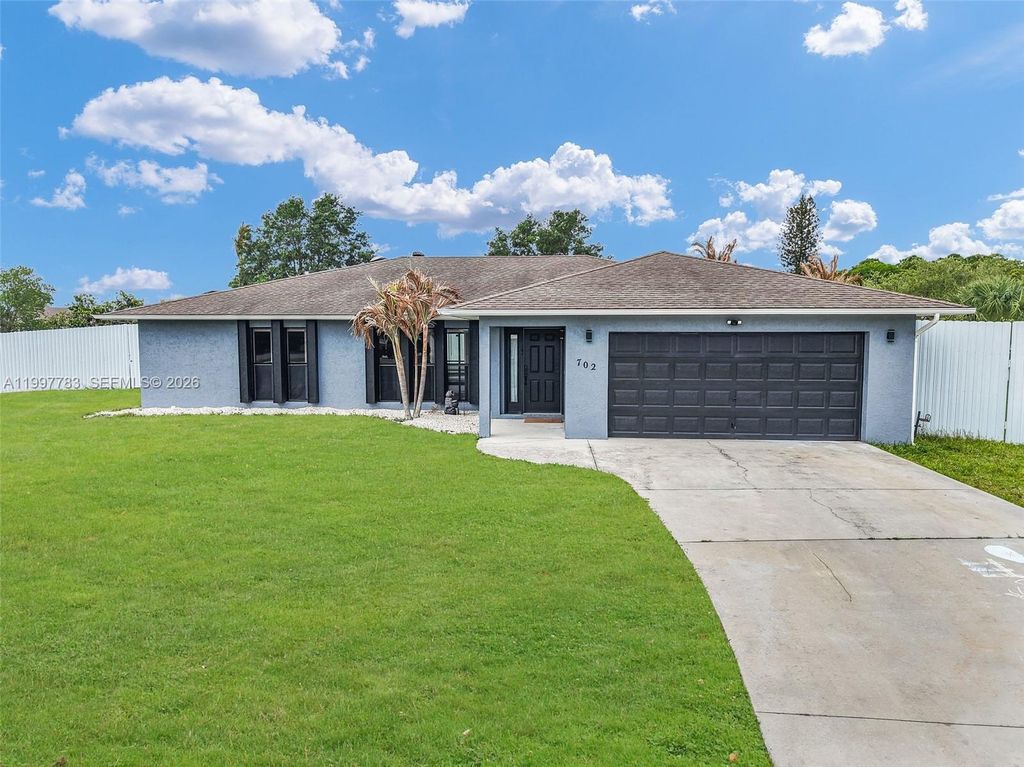 Photo of 702 NW Orchid St, Port St Lucie, FL 34983 (MLS # A11997783)