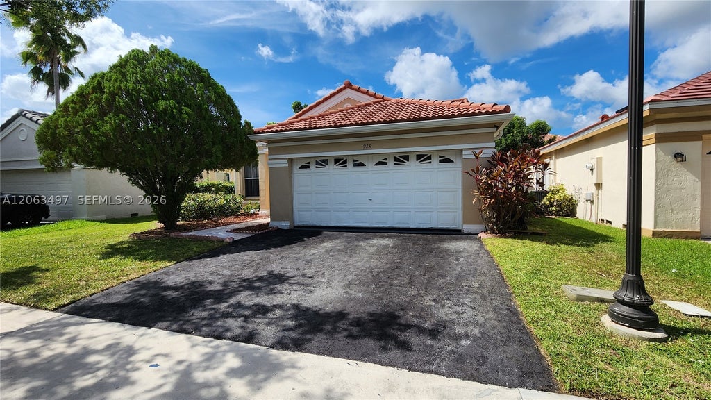Photo of 924 Falling Water Rd #924, Weston, FL 33326 (MLS # A12063497)
