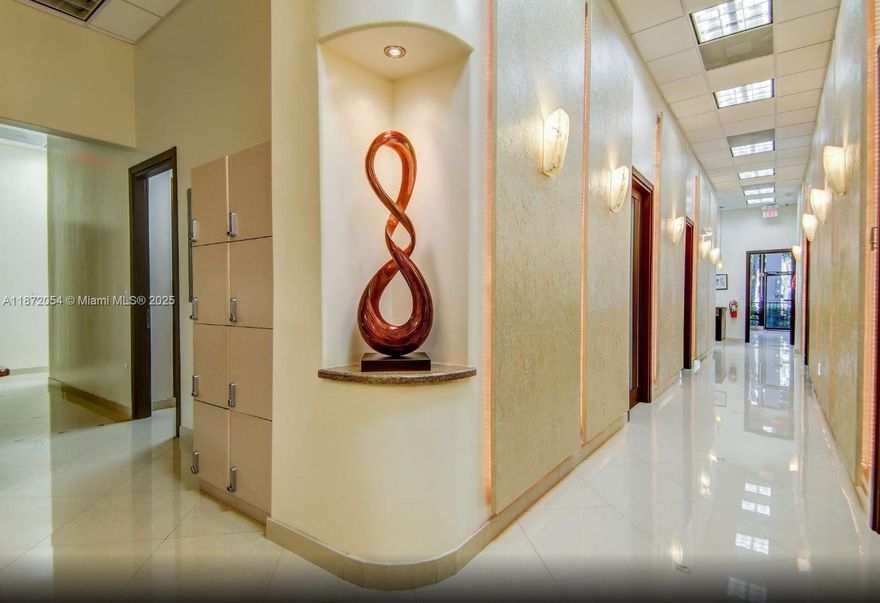 Ground-floor turnkey medical office condo at the Hallmark on Ocean Drive 4,945 SF fully built out with reception, exam/consult areas and 18' ceilings. 15 reserved surface parking spaces included. Prime location directly across from the ocean and diagonally across from the Diplomat Resort; minutes to Golden Beach and Sunny Isles. Professional setting with building signage opportunities and high visibility. Ideal for owner-user medical practice seeking beachside access, patient convenience, and a polished image.