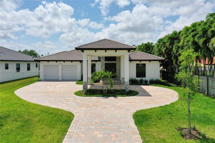NEW CONSTRUCTION PROPERTY.  White shaker cabinets, porcelain floors throughout house all rooms.  Quartz countertops, impact windows and doors, 10 foot ceilings, tray ceilings in formal dining room and master bedroom.  Pool and jacuzzi, pavers, salt system.  4 bedrooms, 3 baths, 2 car garage and port cochere, 14,000 square foot lot, and impact windows.  Luxurious soaking tub, spa like bathroom with rain shower.