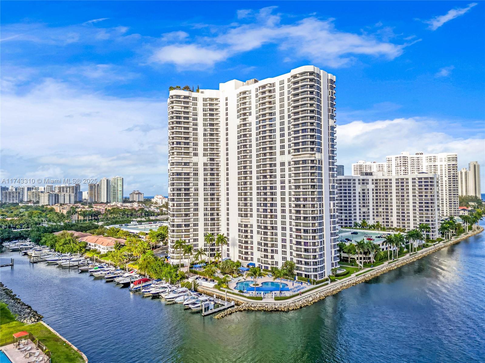 Mystic Pointe offers unparalleled convenience and luxury, with everything you need right at your doorstep. Enjoy on-site dining, marinas, tennis courts, and scenic walking paths, perfect for relaxation and recreation. Nearby boutiques and shops enhance the lifestyle, while stunning intracoastal vistas complete the picture. The prime location keeps you close to leisure activities and daily essentials. This spacious 2/2 renovated corner unit, featuring a modern kitchen with stainless steel appliances, bamboo and porcelain flooring, and impact windows. A wraparound terrace offers serene garden views, and the 3rd-floor location provides direct access to the garage, gym, and amenities. Building has reserves, and budget is attached for your convenience. Experience luxury living at its finest.