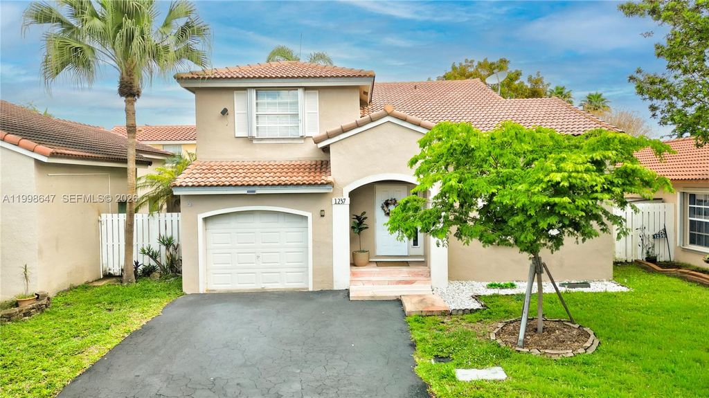 Photo of 1237 NW 125th Ter, Sunrise, FL 33323 (MLS # A11998647)