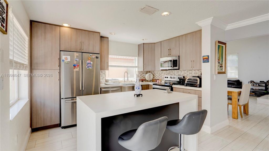 Photo of 1237 NW 125th Ter, Sunrise, FL 33323 (MLS # A11998647)