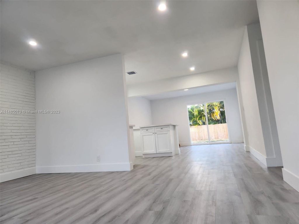 Photo of 731 W Ilex Dr, Lake Park, FL 33403 (MLS # A11485013)