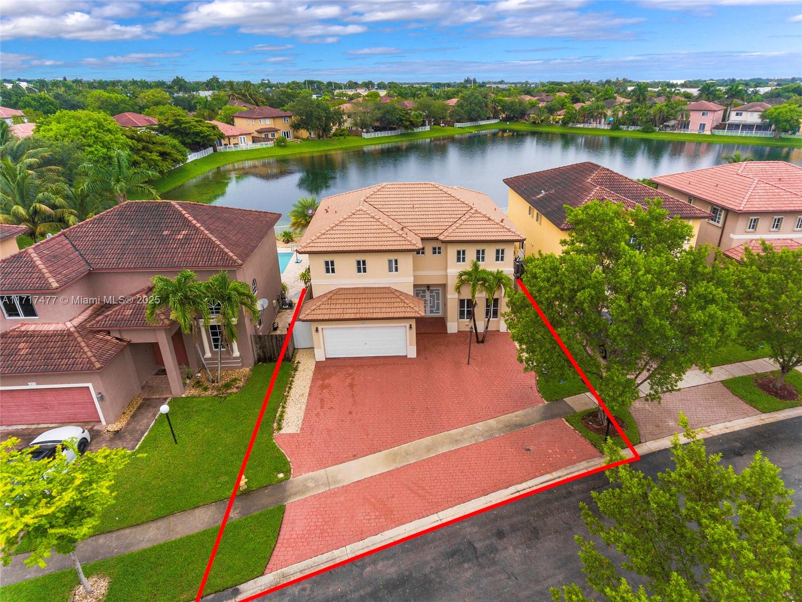 Price to sell! This gorgeous home features breathtaking lake views, creating a peaceful atmosphere. Enjoy added security with double gate access for your comfort. Inside, you'll find brand-new flooring throughout. The master suite has been thoughtfully remodeled, offering an elegant escape. The well-designed layout includes a downstairs bedroom and three upstairs bedrooms, each with its own bathroom, ensuring privacy and convenience for everyone. Step outside to your private backyard haven, complete with a sparkling pool, covered patio, and outdoor kitchen—ideal for both entertaining and relaxing. The community also provides access to a pool and clubhouse.