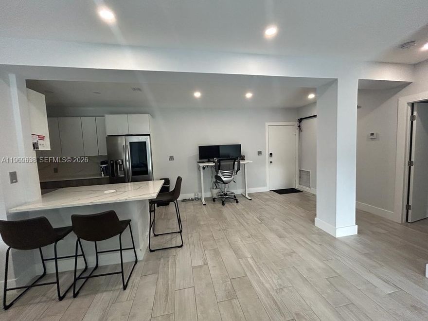 This exceptional 2-bedroom, 2-bathroom condo offers approximately 1,200 square feet of beautifully renovated living space, showcasing a completely modernized interior. The property features a stunning, newly installed kitchen equipped with top-of-the-line stainless steel appliances, elegant Calcutta quartz countertops, and the convenience of wireless charging stations. Step out onto the balcony and enjoy breathtaking views of the sparkling pool, making it the ideal spot for your morning coffee. Added amenities include an in-unit washer and dryer for ultimate convenience. Furthermore, a dedicated parking spot is available for your convenience, and this condo is offered fully furnished and completely ready for immediate occupancy, presenting a truly turnkey opportunity for the discerning buyer.