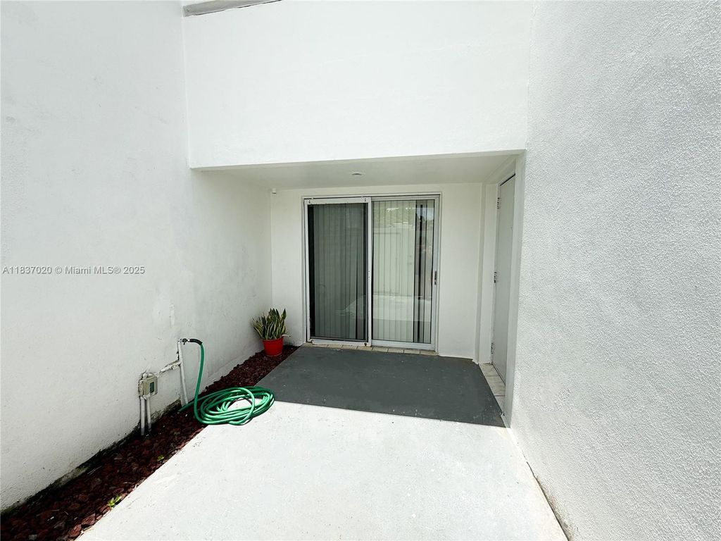 Photo of 5130 Elmhurst Rd #D, West Palm Beach, FL 33417 (MLS # A11837020)