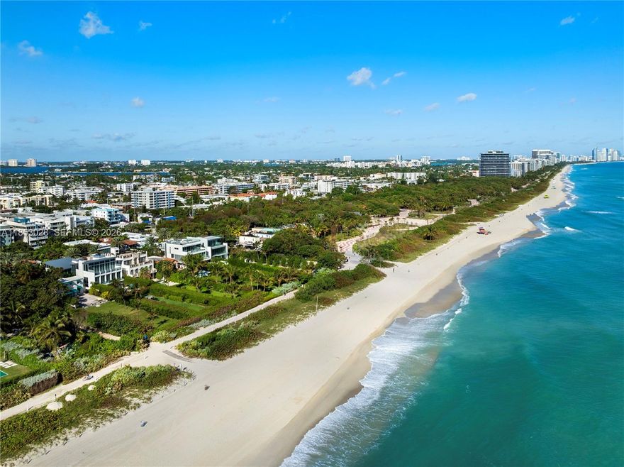 Rising above Miami Beach’s only oceanfront enclave, this contemporary estate by Ramon Pacheco & Coastal Construction spans 3 levels w soaring 11–14’ ceilings, walls of glass & an interior water courtyard. Dual chef’s kitchens w Wolf, Sub-Zero & Gaggenau appliances, multiple entertaining areas, wine cellar & full smart home automation define modern sophistication. The 3rd-floor primary suite offers a private oceanfront terrace & spa bath, while a steam shower at pool level provides the ultimate in relaxation. Outdoors, an updated saltwater pool, summer kitchen, firepit, sunken lounge & refinished stone terraces create a resort-like escape. Enhancements include new A/C, TVs & AV, brand-new driveway, onyx kitchen counter tops, full-house generator, water purification & 2-car A/C garage.