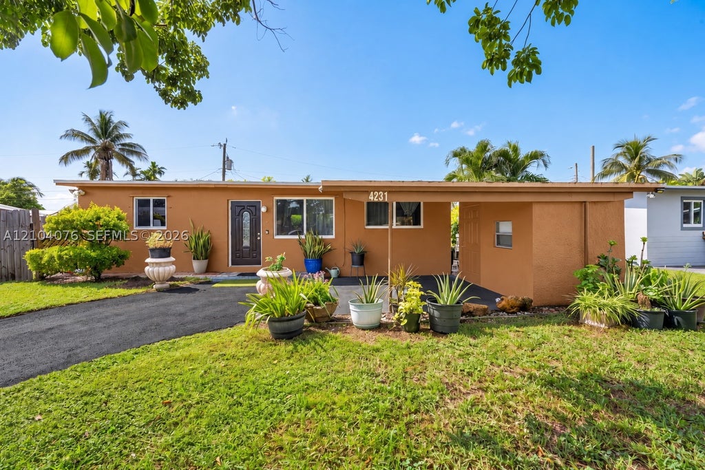 Photo of 4231 NW 12th Ave, Oakland Park, FL 33309 (MLS # A12104076)