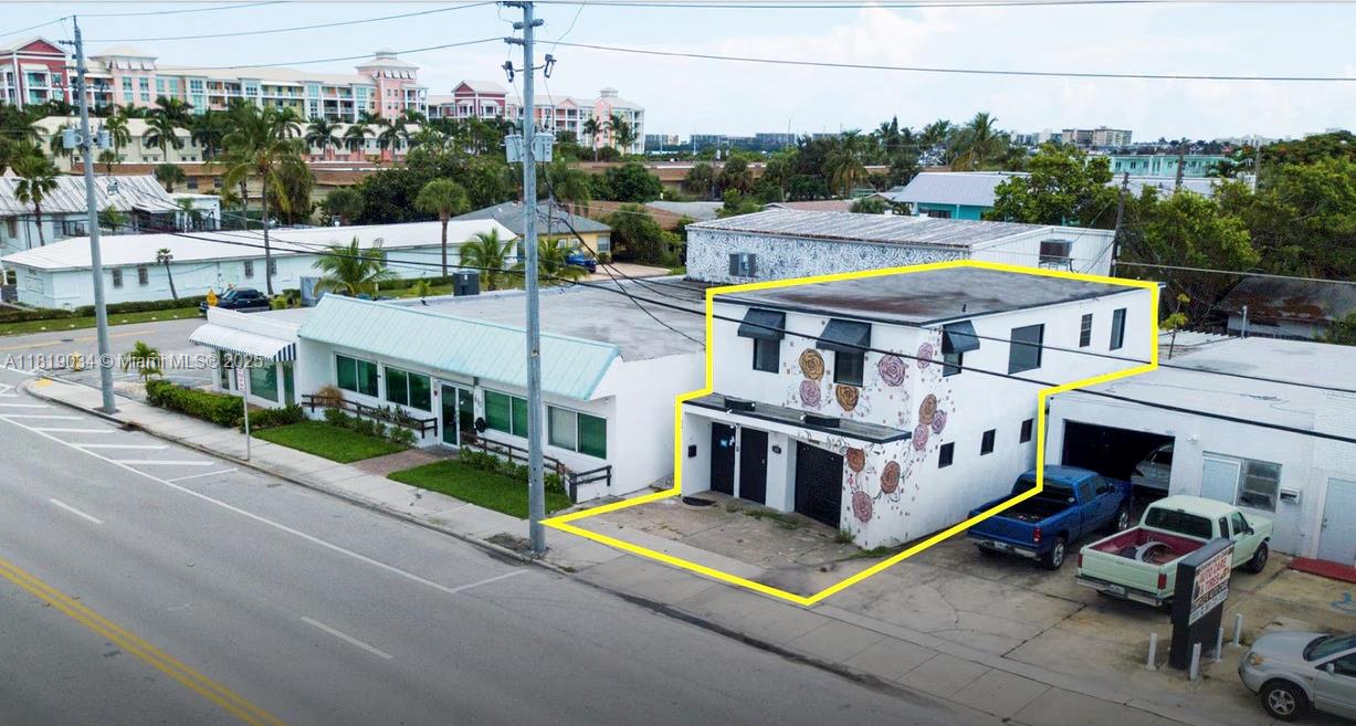 This unique property offers exceptional value and is priced to sell. The top level consists of a fully remodeled apartment which could also be used as an Office. Level one consists of two separate garage spaces, in which 4-5 vehicles could be parked inside. Additionally, the rear end of the property has some outdoor area covered to park another two vehicles, and the front of the building also has more parking area to use. The property is vacant and presents an excellent opportunity for an owner-user to occupy one section (even potentially using level 1 as a residence) while generating rental income fr