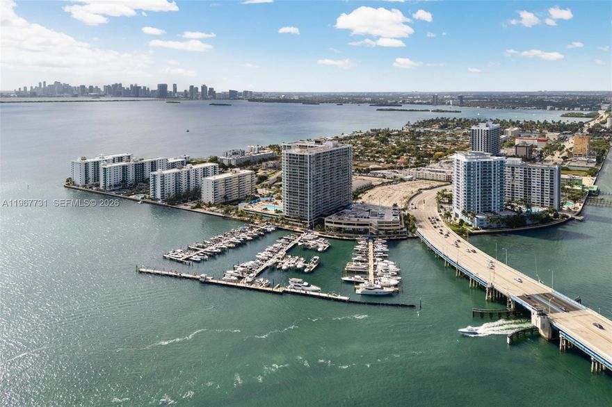 The most desirable line in the building. Enjoy unobstructed Biscayne Bay views from every room in this beautifully updated 23rd-floor residence at Grandview Palace. This line captures sweeping water vistas and exceptional natural light. Expansive living areas open through solid wood pocket doors to a full-length balcony, creating seamless indoor-outdoor living. Split floor plan offers privacy and functionality. This turnkey 2BR/2BA features high-end finishes throughout, including new flooring, updated bathrooms, and a sleek kitchen with granite countertops and stainless steel appliances. Tankless water heater, in-unit washer/dryer, and 2 assigned parking spaces. Resort-style amenities: Olympic-size pool, Jacuzzi, marina, 24-hour security, dining, retail, and salon. Prime North Bay Village location.