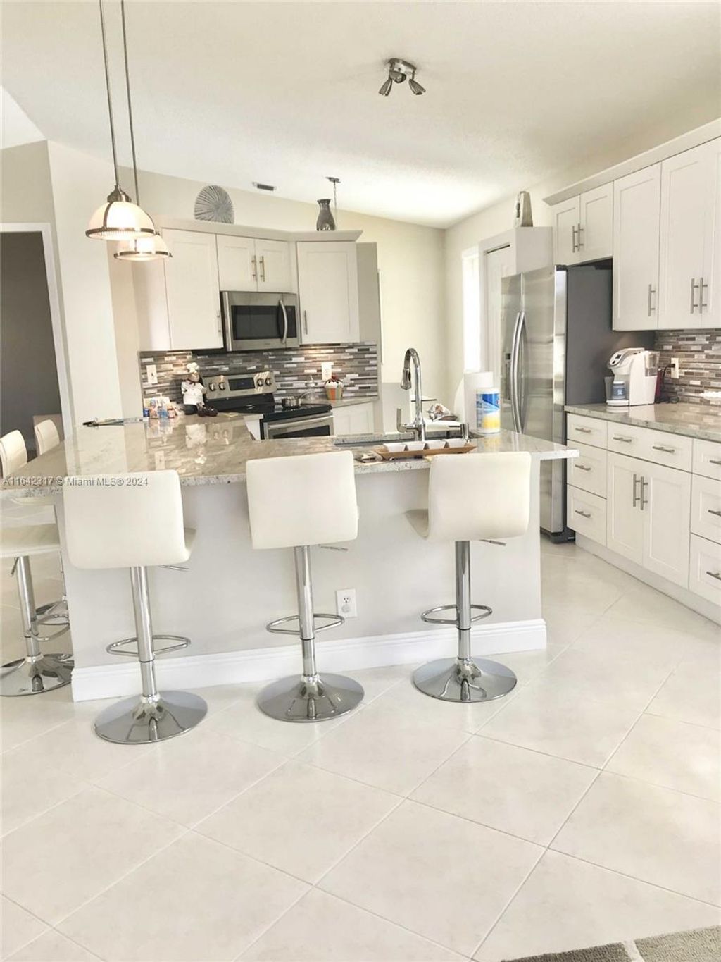 Photo of 9731 Cherry Blossom Ct, Boynton Beach, FL 33437 (MLS # A11642317)