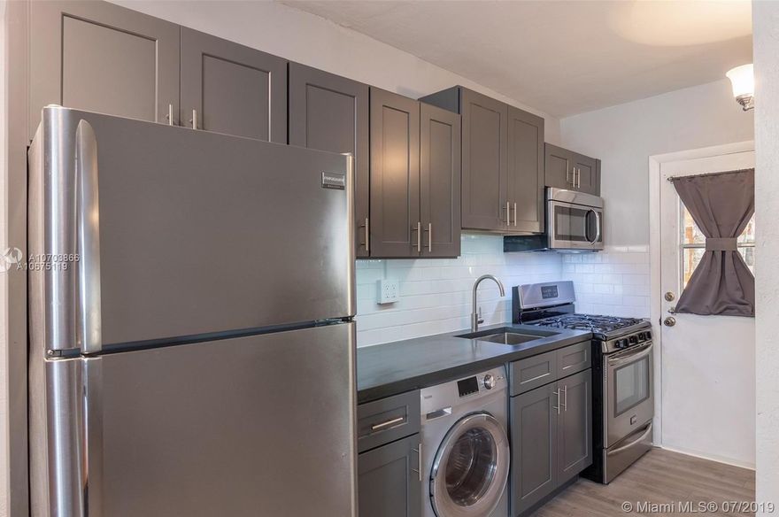 Elegant and modern 1-bed, 1-bath condo east of US-1 in South Miami.  First-floor unit so no stairs to climb up and down. Newly and entirely renovated with new floors, updated bathroom, and modern kitchen features subway tile backsplash and butcher block countertop. Spacious walk-in closet and convenient washer/dryer in unit. Peaceful community tucked away with a nice canal and Pool.  It also comes with one reserved parking spot and ample Guest parking. Great location just minutes to Sunset Place, the Metro, Dadeland Mall and the University of Miami.