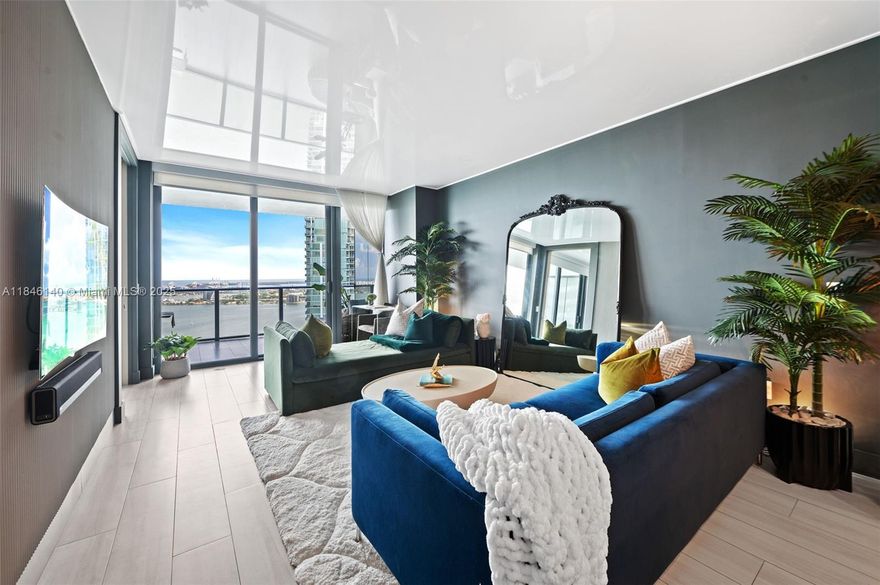 Paraiso Bay: This elegant and sophisticated professionally designed remodel is filled with unique luxury finishes and upgrades you must see in person to appreciate.   Pano views of Biscayne Bay, Atlantic and Edgewater skyline with oversized rare bubble balcony (9'X24'), custom Lighting, Reflective Opaque Ceilings, 3D Accent Walls, textured Italian wall papers, custom closets, ceramic Oak flooring and 1 car assigned parking. Endless amenities include 2 acre pool deck, 100' round pool, spas, tennis courts, fitness, club rooms, indoor/outdoor kitchens/entertainment areas, cigar and wine rooms, game rooms, bowling alleys and more.  Paraiso Bay is an established condominium project with no special assessments and completed 558. Option to purchase with designer furnishings. WHOLE FOODS 1/4 mile.