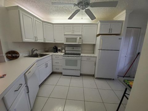Photo of 1750 NE 191st St #105-1, Miami, FL 33179 (MLS # A12007369)