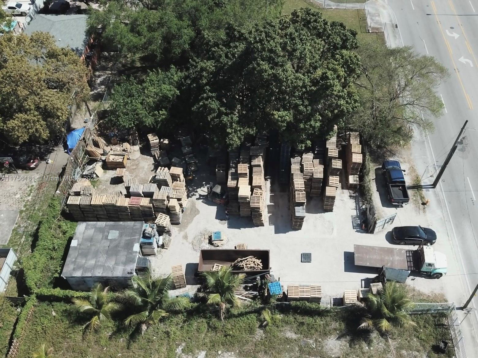 Two lots 9,675 sqft total, with 400 sq ft office, For Sale! Buy Lots together or separate. Licensed pallet business, equipment, and inventory are negotiable. Zoned Mixed Use, allows development of residential and commercial. Permits buildings with shops, offices, and apartments. Close to Miami International Airport and Major Expressways.