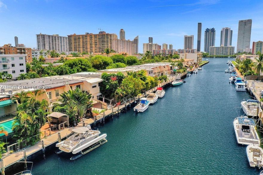 Fully remodeled waterfront townhouse in Eastern Shores with private boat dock and new seawall (assessment paid by seller)! This 2BR/2.5BA home features a bright, open layout, formal dining, and a private patio with direct water access—ideal for kayaking, fishing, or boating. Upstairs offers two spacious bedrooms, including a master suite with balcony views of the canal. Enjoy the best of coastal living just minutes from Sunny Isles Beach, Aventura Mall, and the Intracoastal. HOA approval required. Boaters DREAM! Less than 5 minute boat ride to Haulover Sandbar / Haulover Inlet. Impact windows + Doors!