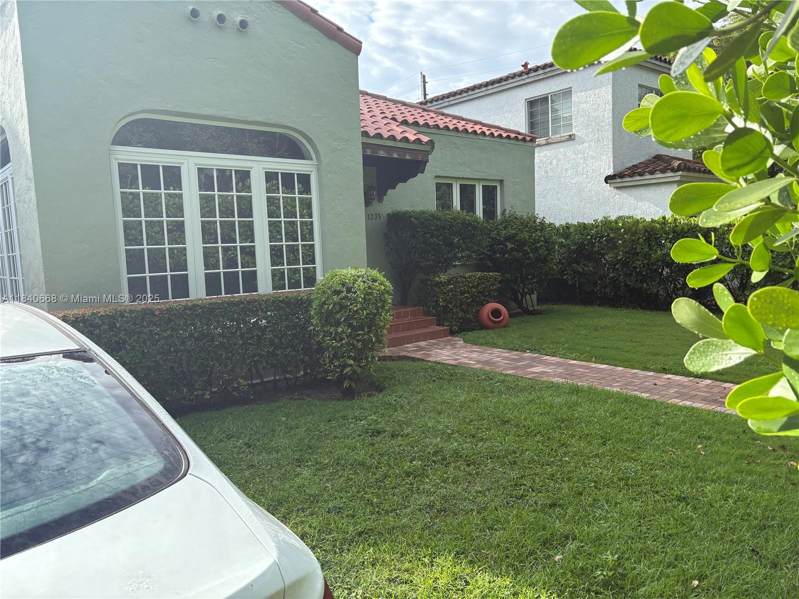 Historic Old Spanish with beautiful original wood floors, fireplace, formal living and dining room. Arched interiors with high ceilings and colonial windows. Impact Windows, Updated bathroom in a quiet great location.