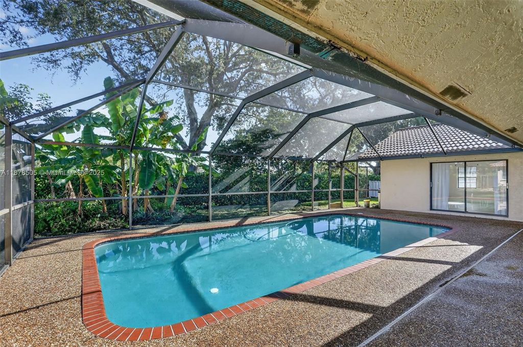 Photo of 8419 NW 55th Ct, Coral Springs, FL 33067 (MLS # A11878505)