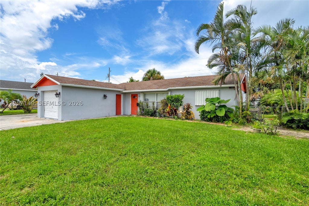 Photo of 1320 W 26th Ct, Riviera Beach, FL 33404 (MLS # A12057140)