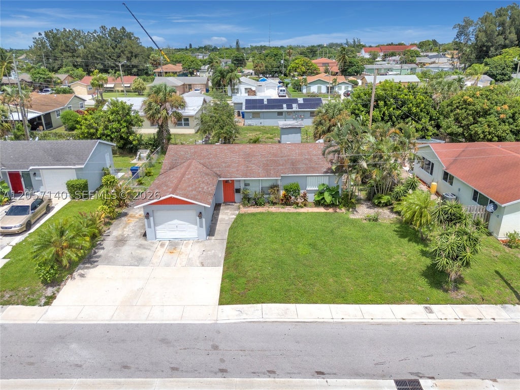 Photo of 1320 W 26th Ct, Riviera Beach, FL 33404 (MLS # A12057140)
