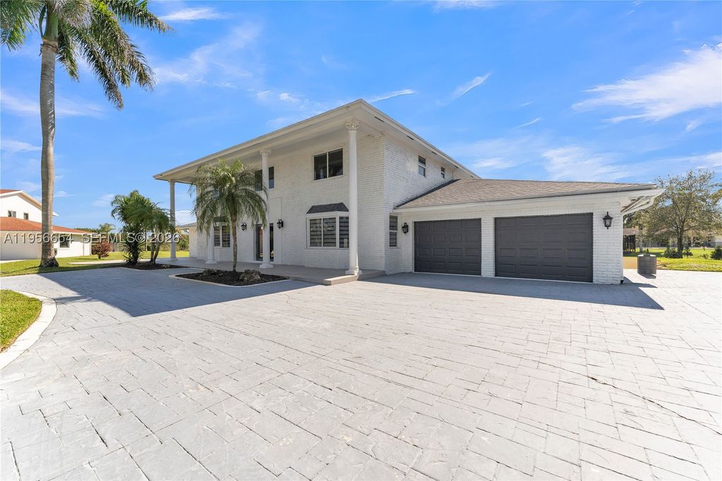 Photo of 11824 SW 43rd Ct, Davie, FL 33330 (MLS # A11956654)