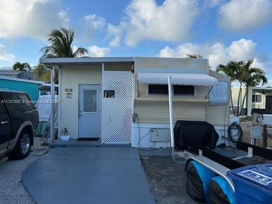 Welcome to paradise living in coveted Outdoor Resort at Long Key Florida, located on MM 66 where you own the land! Property features a two bedrooms, one bathroom; lower level entry and kitchen area; upgraded drywall in bedrooms; stackable washer/dryer, elec. water heater, gas range/oven; canal view with no backyard neighbor; parking for two cars, a 24' boat, and a golf cart. Outdoor Resort offers a community pool; tennis/pickleball courts; clubhouse; game room; private boat ramp and marina with convenience store and gas station; access to private beach; boat slips; tiki island for picnic or fishing; new gym/wellness center; and has gated 24/7 security. Outdoor Resort is known as a great family oriented community, and a fishermen's paradise. Great vacation home or for rental income.