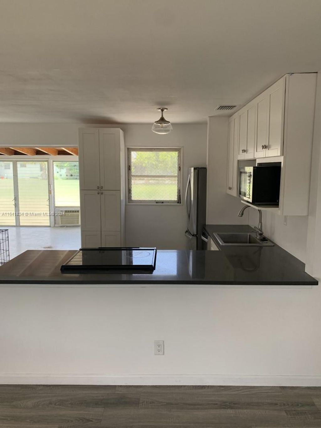 Photo of 707 Greenbriar Dr #n/a, Lake Park, FL 33403 (MLS # A11641834)