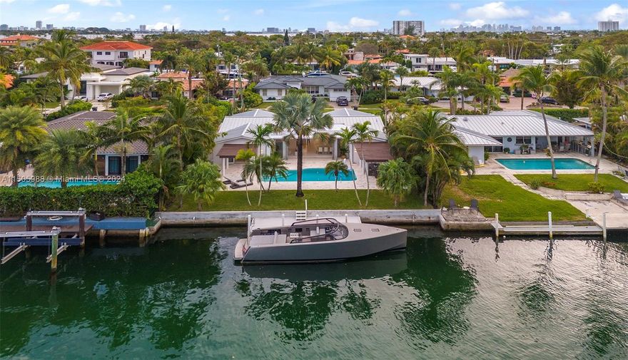 SELLER MOTIVATED! Modern, completely renovated waterfront oasis in gated Keystone Islands. This boater's paradise offers 75' of deep water frontage, ocean access & no fixed bridges to Bay. The elegant interiors feature chic upgrades & finishes, new marble floors throughout & open living spaces. Enjoy seamless indoor/outdoor living w/triple pane impact doors that completely recess. The open eat-in custom gas kitchen by ItalKraft has a huge island, coffee bar, sintered stone countertops & top-of-the-line appliances. The backyard boasts a heated saltwater pool, Trellis, & summer kitchen, perfect for Al Fresco dining. Tastefully remodeled for today's living, this gated Smart Home is complete w/impact windows, generator, tankless water heater & numerous newly installed tech features throughout.