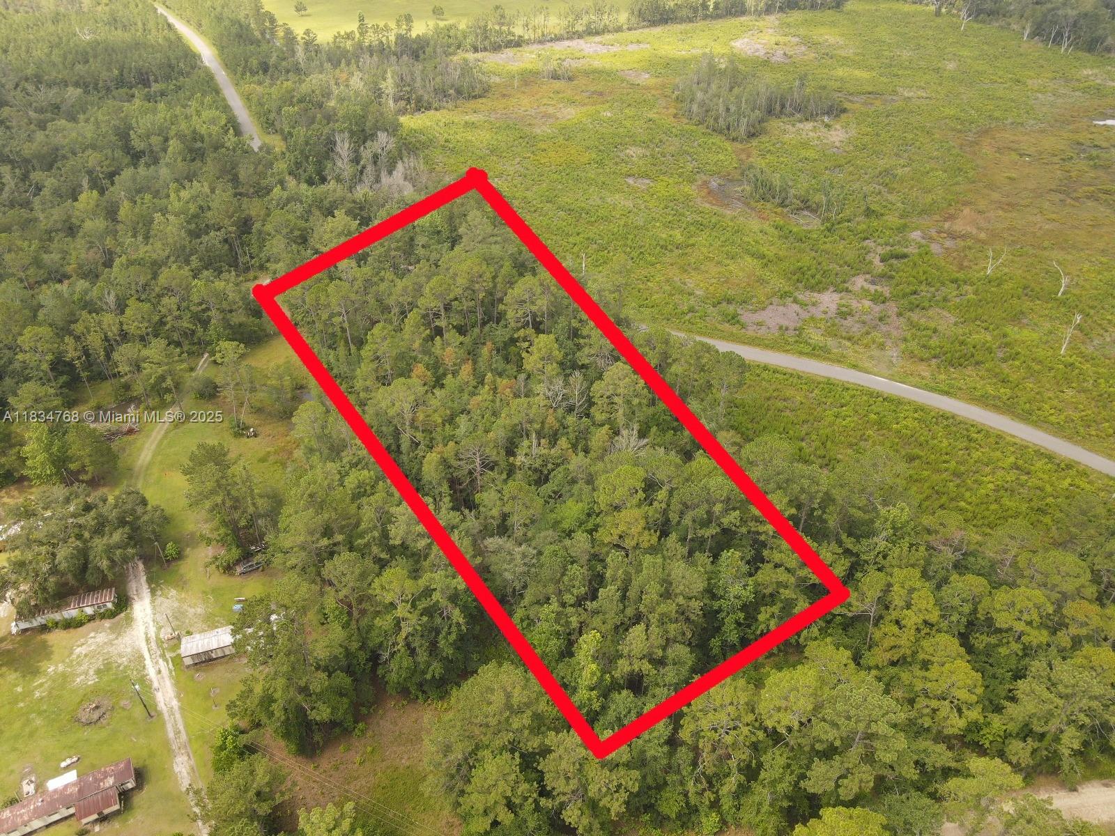 Land for Sale – Flatwoods, FL 32344. Size: 2.0 Acres. Location: Flatwoods Road, Monticello, Florida 32344. Property Highlights: Buildable lot with plenty of space; Power available on the road; 411.75 feet of road frontage; Peaceful rural setting surrounded by large parcels; No HOA – flexible use for site-built or modular homes. About 40 minutes to Tallahassee. Ideal for a private homesite, small farmstead, or investment property. A great opportunity to own land in a growing area with country charm and future potential.