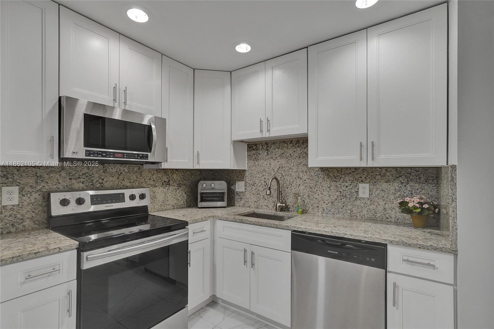 Bright and modern first-floor 2-bedroom, 2-bath condo in a 55+ community. Enjoy a spacious master bedroom with walk-in closet, a sleek kitchen with stainless steel appliances, and social amenities right across the street—pool, clubhouse, and activities. Convenient parking steps away and on-site laundry for easy living. Perfect for comfort and relaxation in Lauderhill!