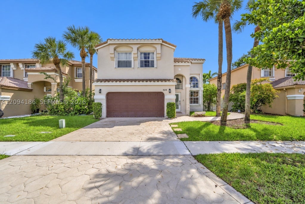 Photo of 325 NW 158th Ln, Pembroke Pines, FL 33028 (MLS # A12094186)
