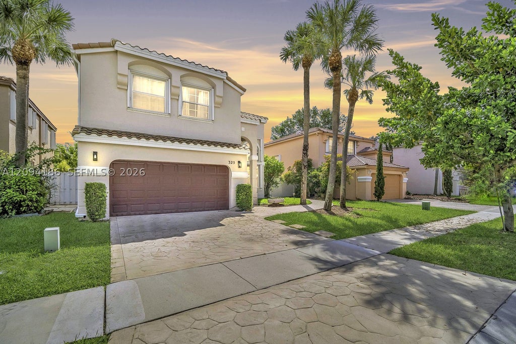 Photo of 325 NW 158th Ln, Pembroke Pines, FL 33028 (MLS # A12094186)